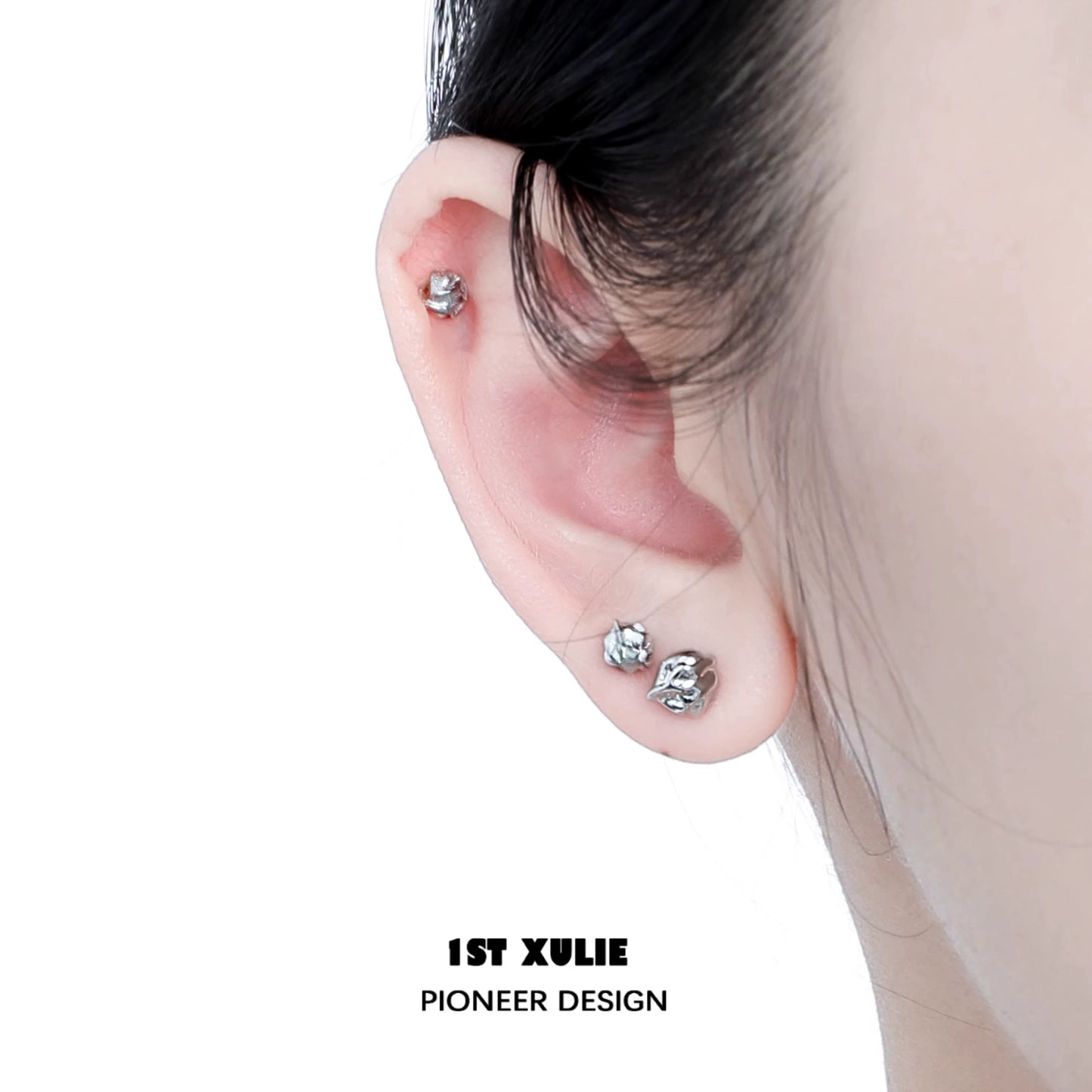 Close-up of minimalist bell echo earrings worn on an ear showcasing their elegant design