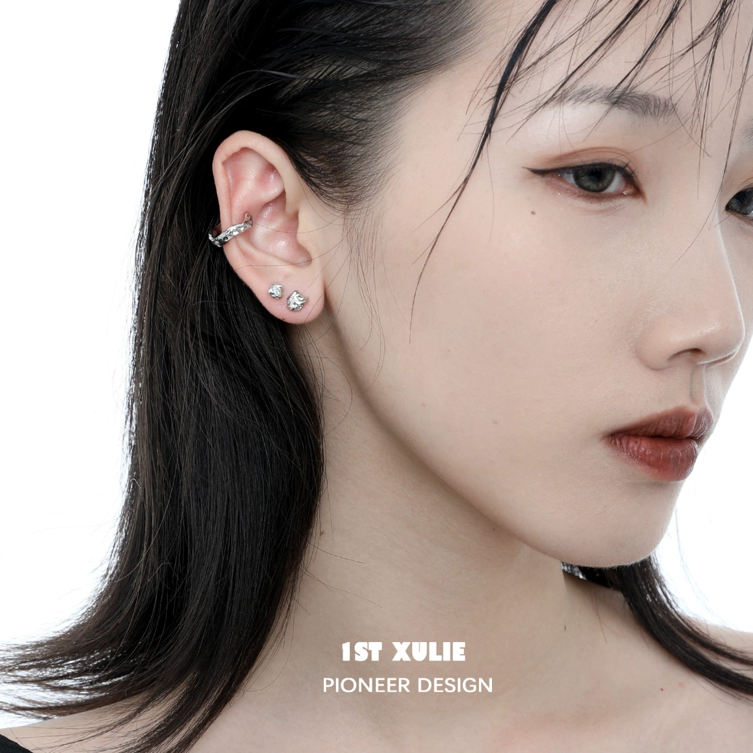 Minimalist bell echo earrings displayed on a model highlighting their elegant design and shine