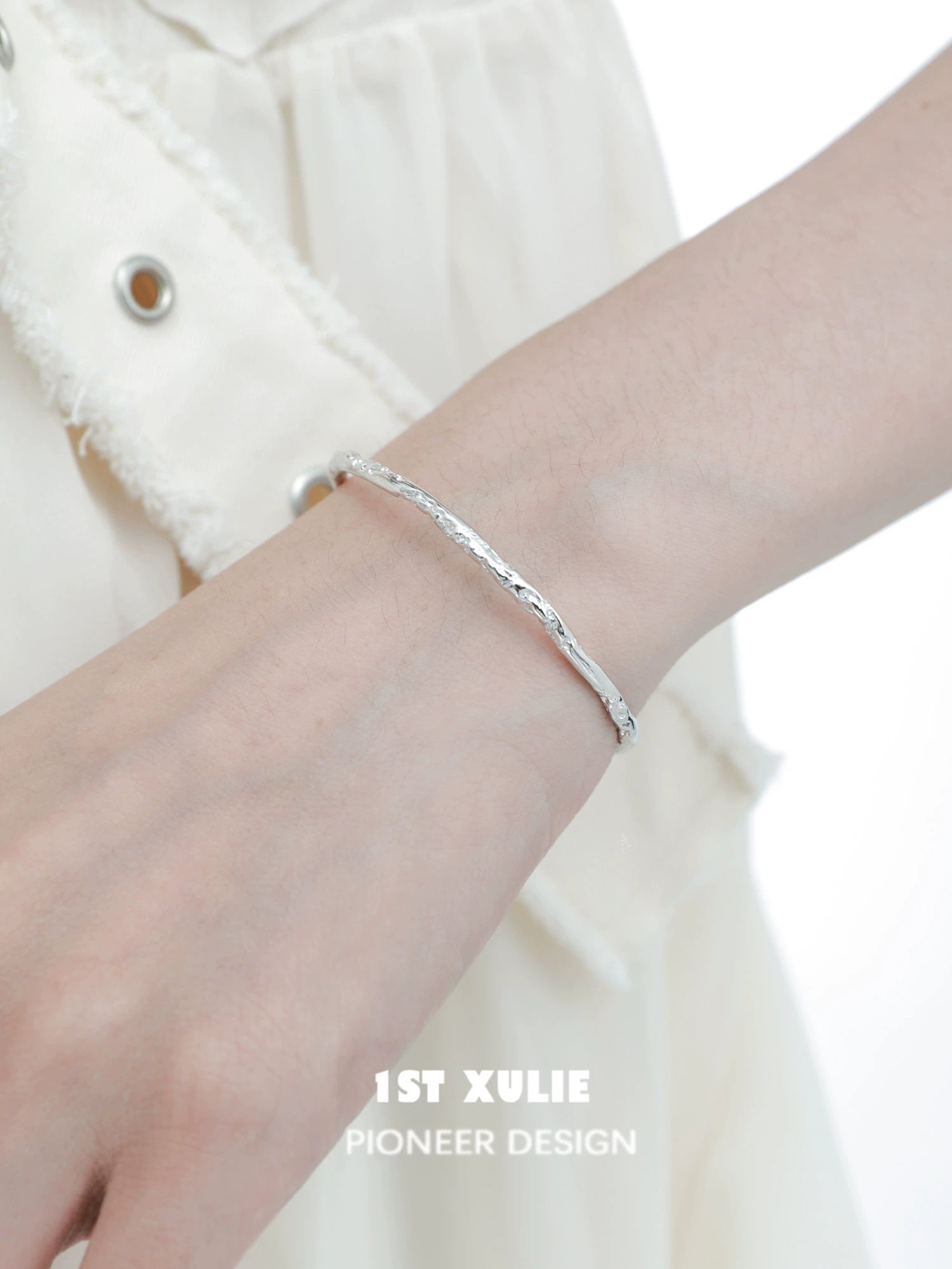 Stylish minimalist silver bracelet featuring a sleek design, perfect for everyday wear