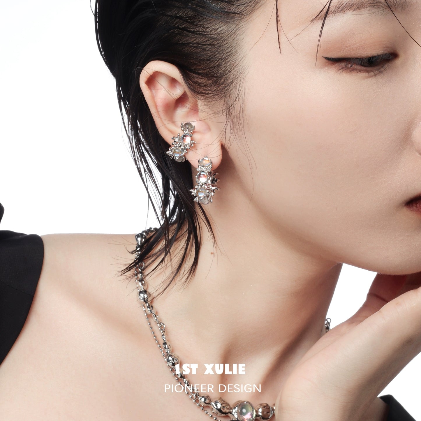 Elegant moonstone hoop earrings featured on a model showcasing their unique design