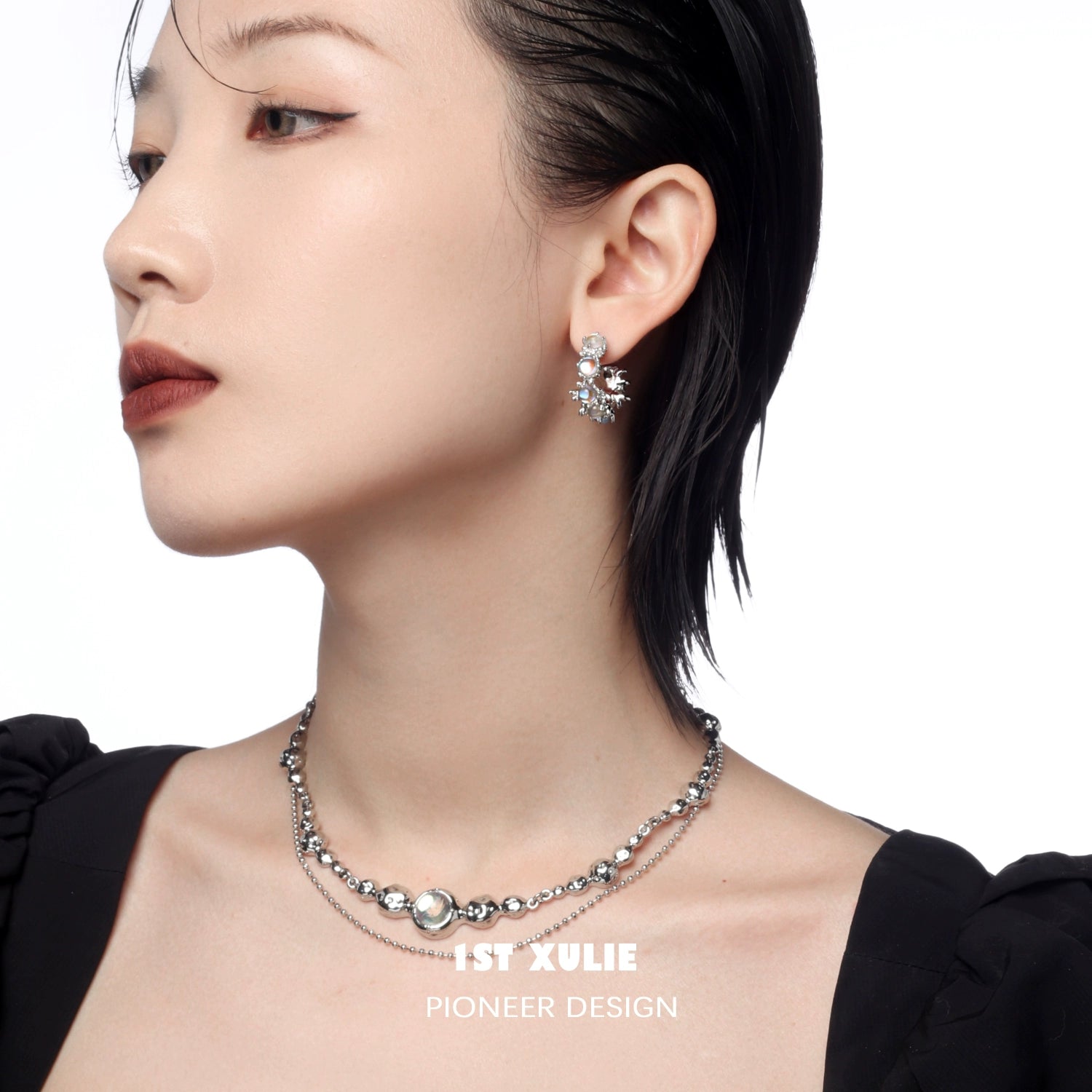 Model wearing elegant moonstone hoop earrings paired with a stylish necklace for a chic look