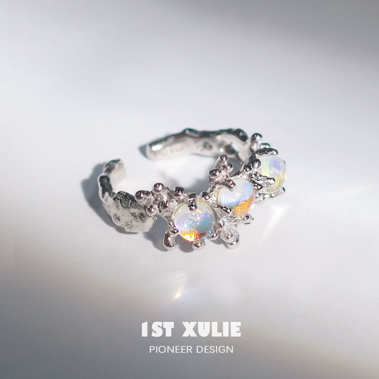 Moonstone silver ring featuring intricate design with multiple gemstones for a unique look