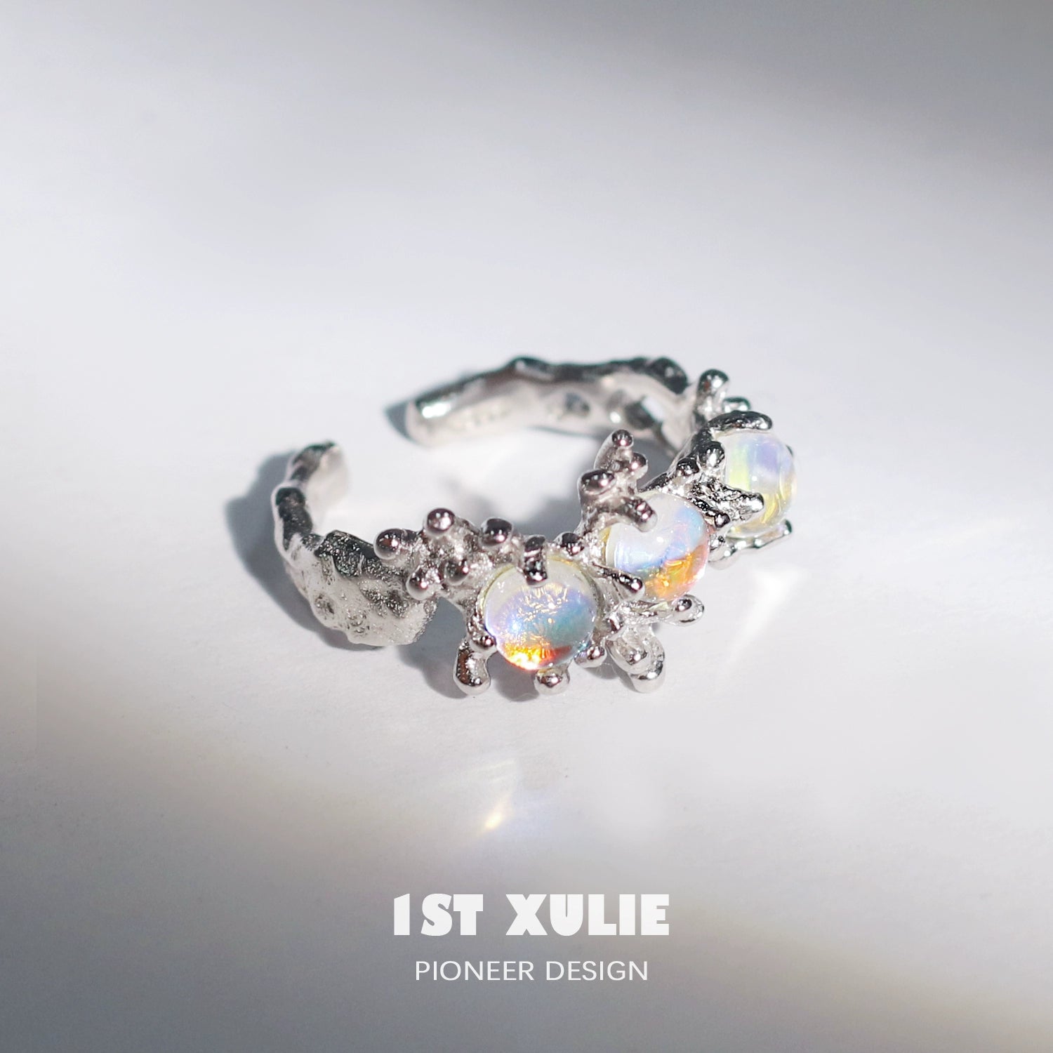 Moonstone silver ring featuring intricate design with multiple gemstones for a unique look