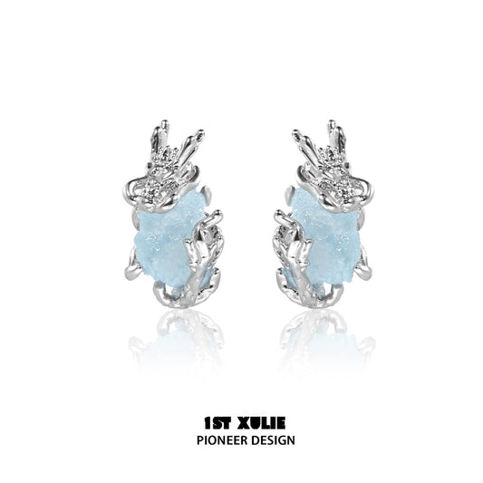 Mystic elf earrings featuring silver design and blue stone for a magical touch