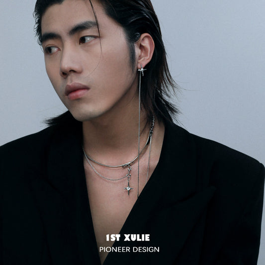 Stylish model wearing a mystic star necklace layered with silver chains for a trendy look