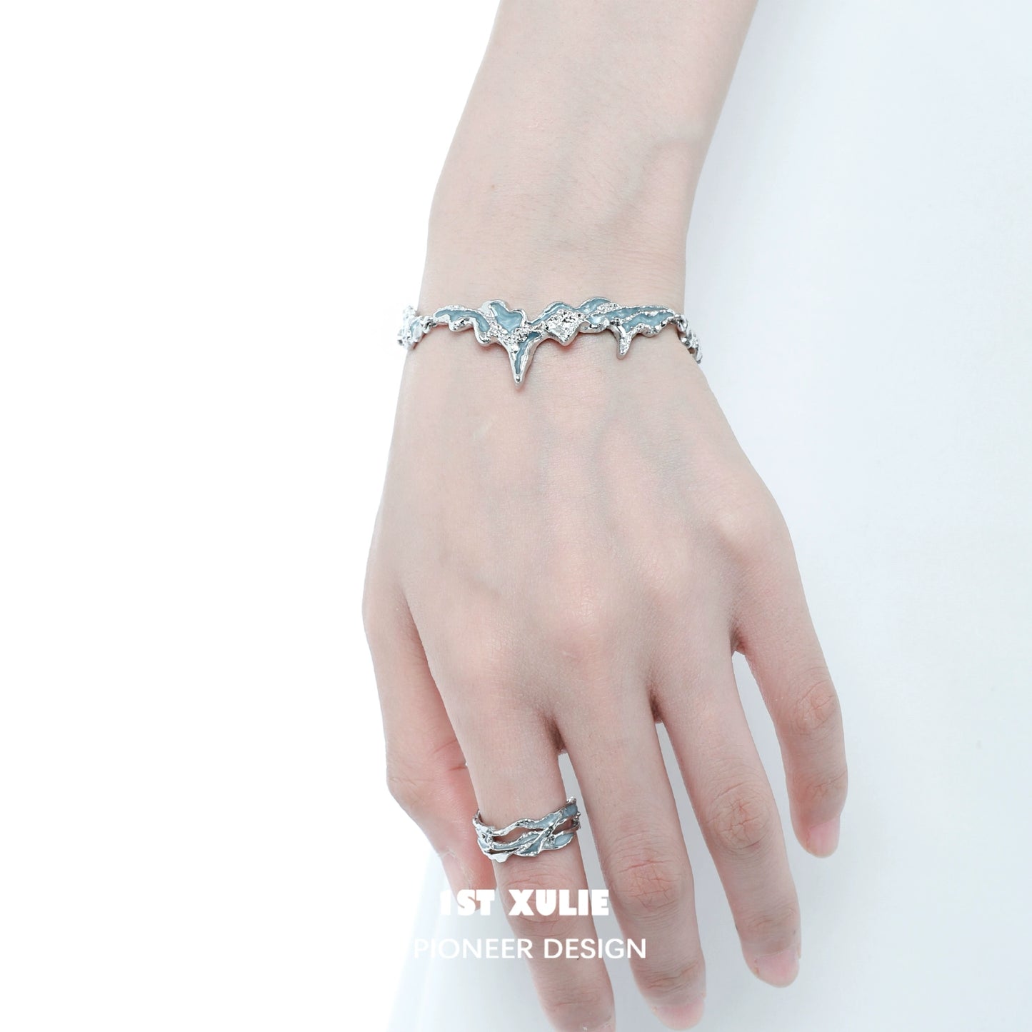 Elegant mystical blue silver bracelet showcasing intricate design worn on a model's wrist