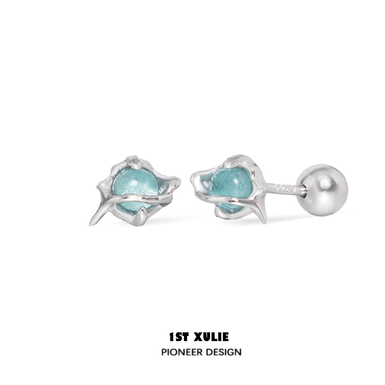 Stylish ocean blue stud earrings featuring a unique design with silver accents