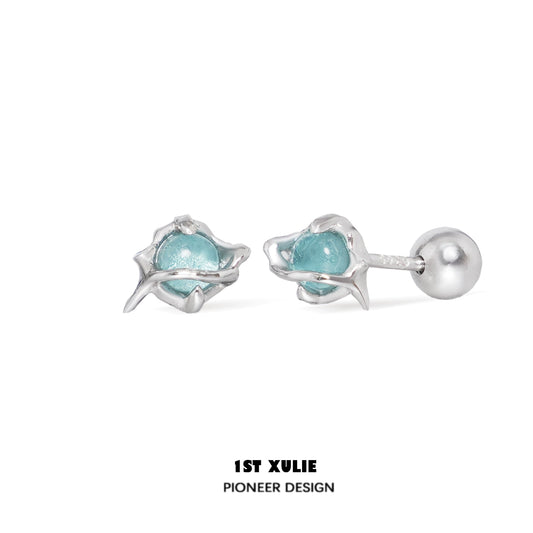 Stylish ocean blue stud earrings with unique floral design and silver accents
