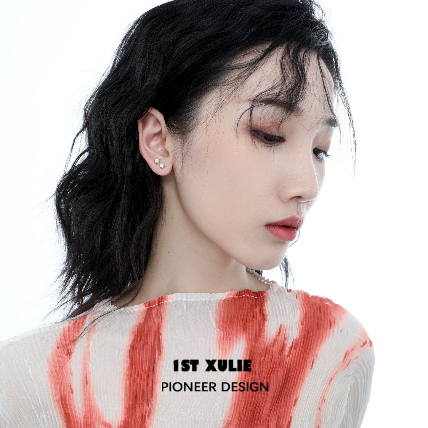 Model wearing elegant 1ST XULIE opal stud earrings that add a touch of sophistication