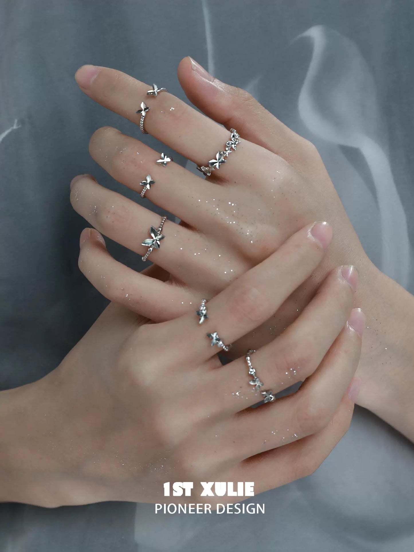 Stylish punk butterfly silver ring showcased on multiple fingers with intricate designs