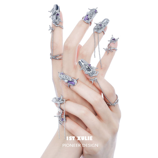 Elegant designs featuring purple butterfly nail rings on intricately adorned fingers