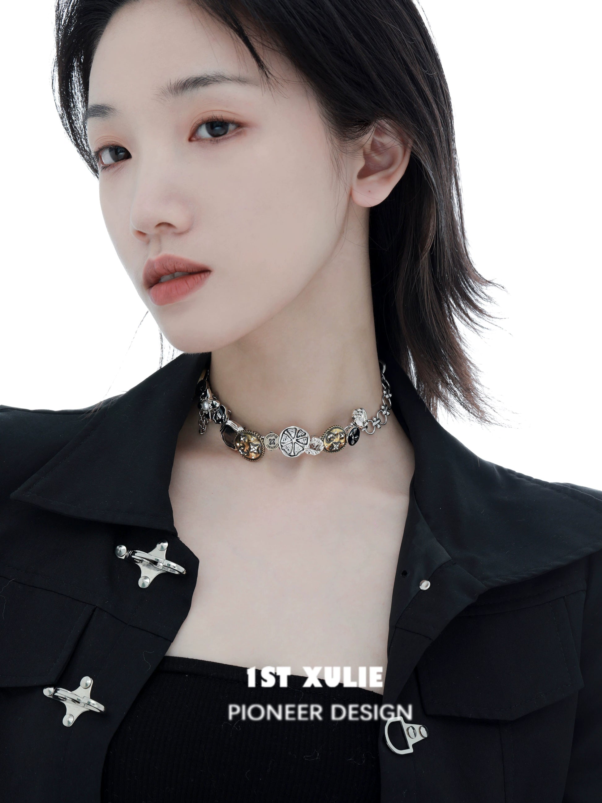 Fashion model wearing a retro button necklace featuring decorative buttons and a stylish design