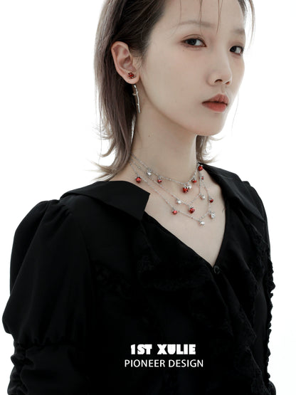 Stylish model wearing a rose kiss clavicle chain necklace with elegant design and colorful accents