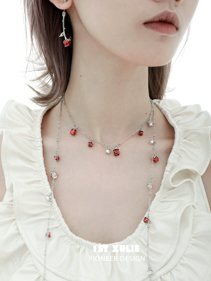 Elegant rose kiss clavicle chain necklace featuring delicate red rose charms and silver accents