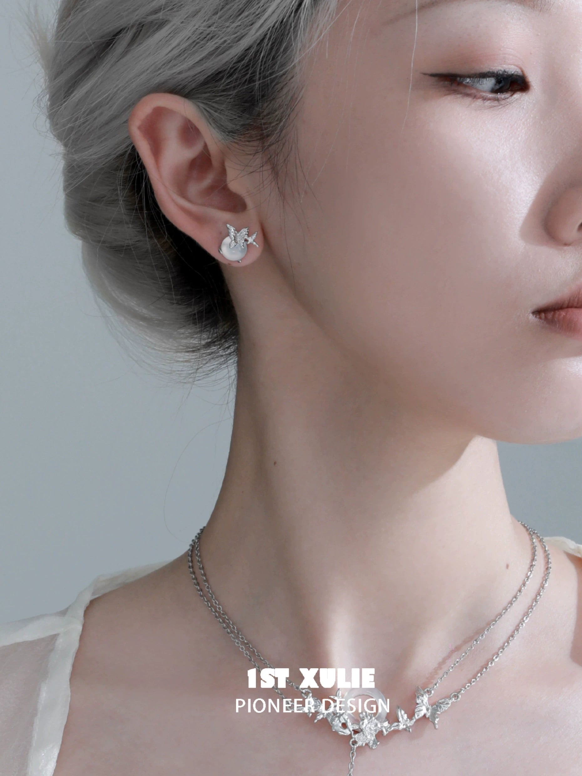 Elegant silver butterfly stud earrings showcasing a delicate design perfect for everyday wear