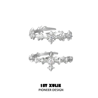 Elegant silver cross couple rings with intricate design and sparkling accents from 1STXULIE