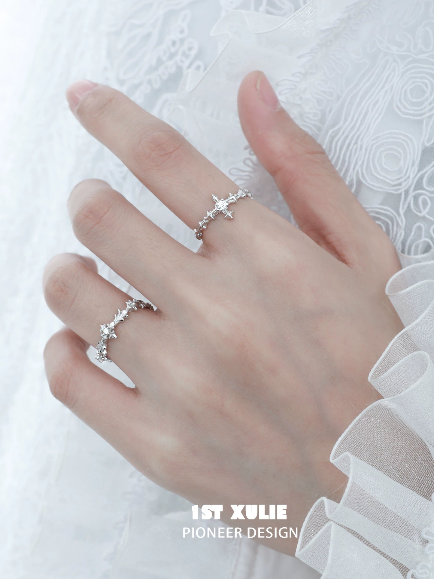 Elegant silver cross couple rings with intricate design and sparkling details for romantic gestures