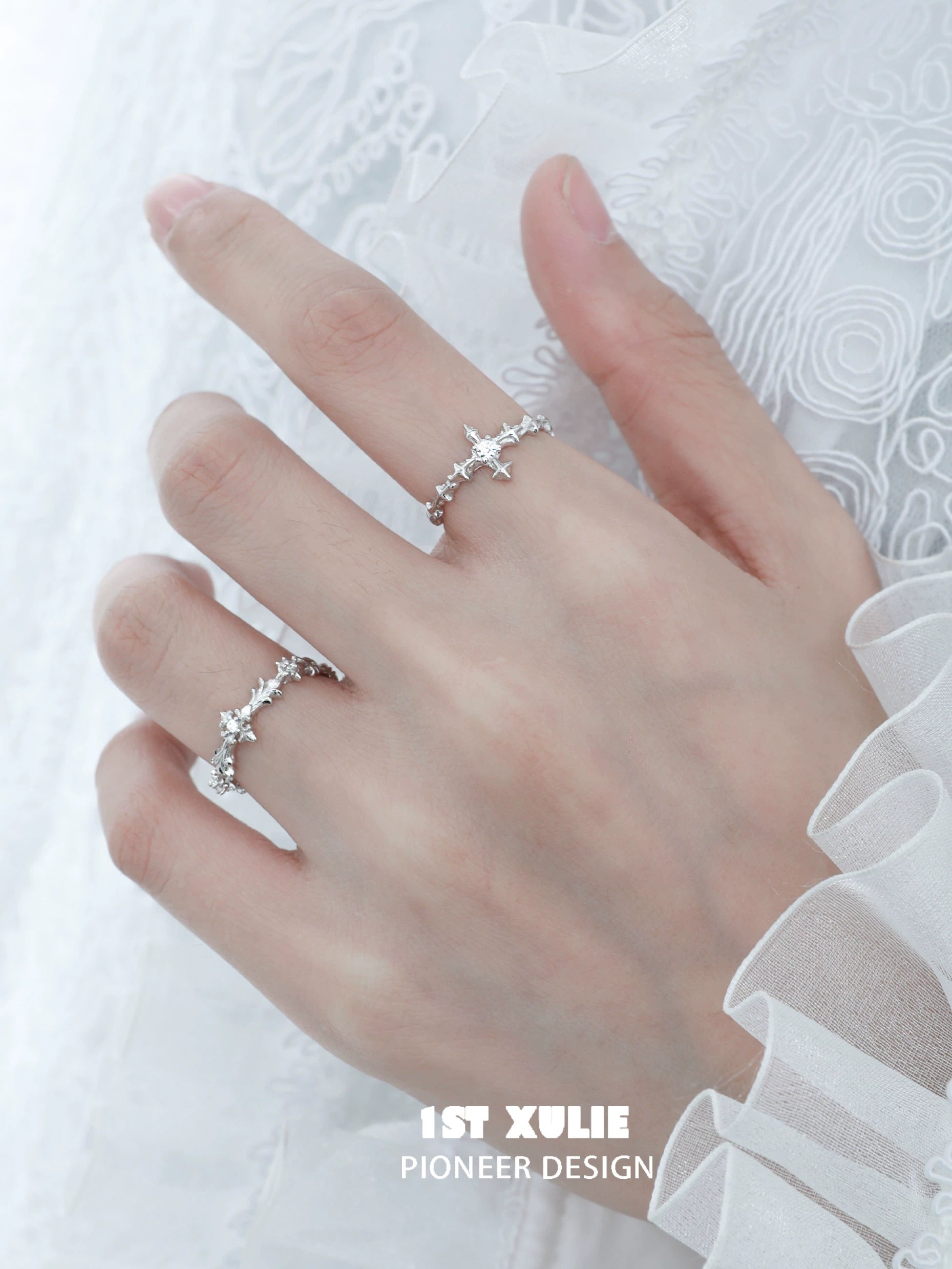 Elegant silver cross couple rings with intricate design and sparkling details for romantic gestures