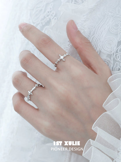 Elegant silver cross couple rings with intricate design and sparkling details for romantic gestures