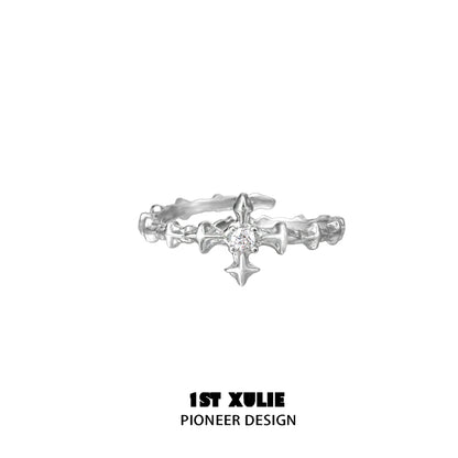 Elegant silver cross couple rings featuring a delicate design and sparkling center stone