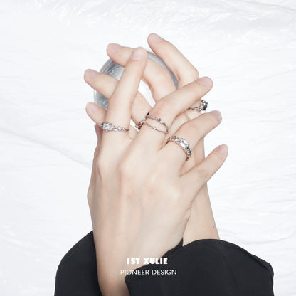 Elegant silver crown couple ring showcased on intertwined hands for a romantic touch