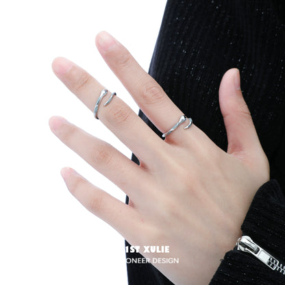 Stylish silver snake ring on hand, perfect for unique fashion statement