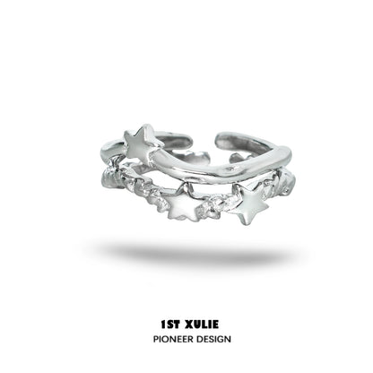 Silver star couple ring featuring a unique intertwined design with star accents