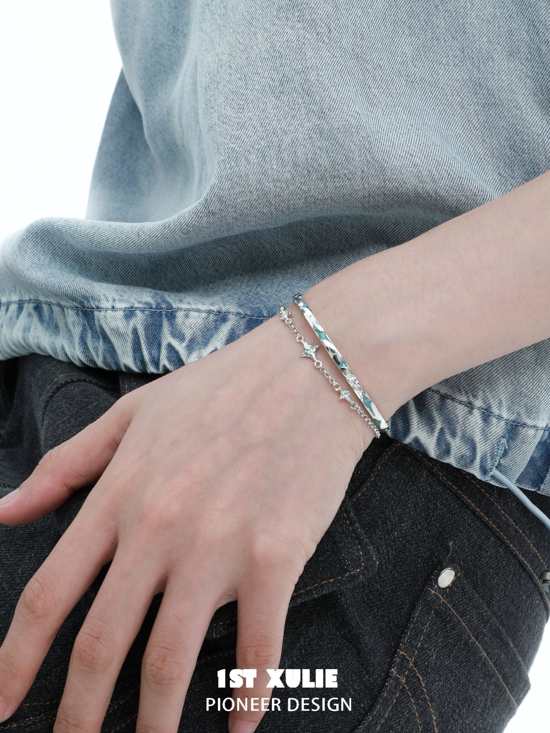 Elegant silver starlight bracelet on a wrist, showcasing its shimmering design and modern style