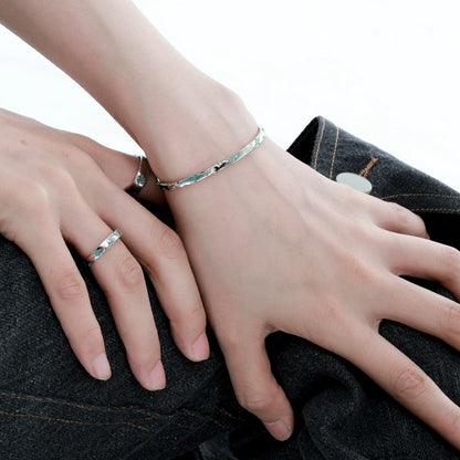 Elegant silver starlight bracelet worn on a wrist with matching ring for a stylish look