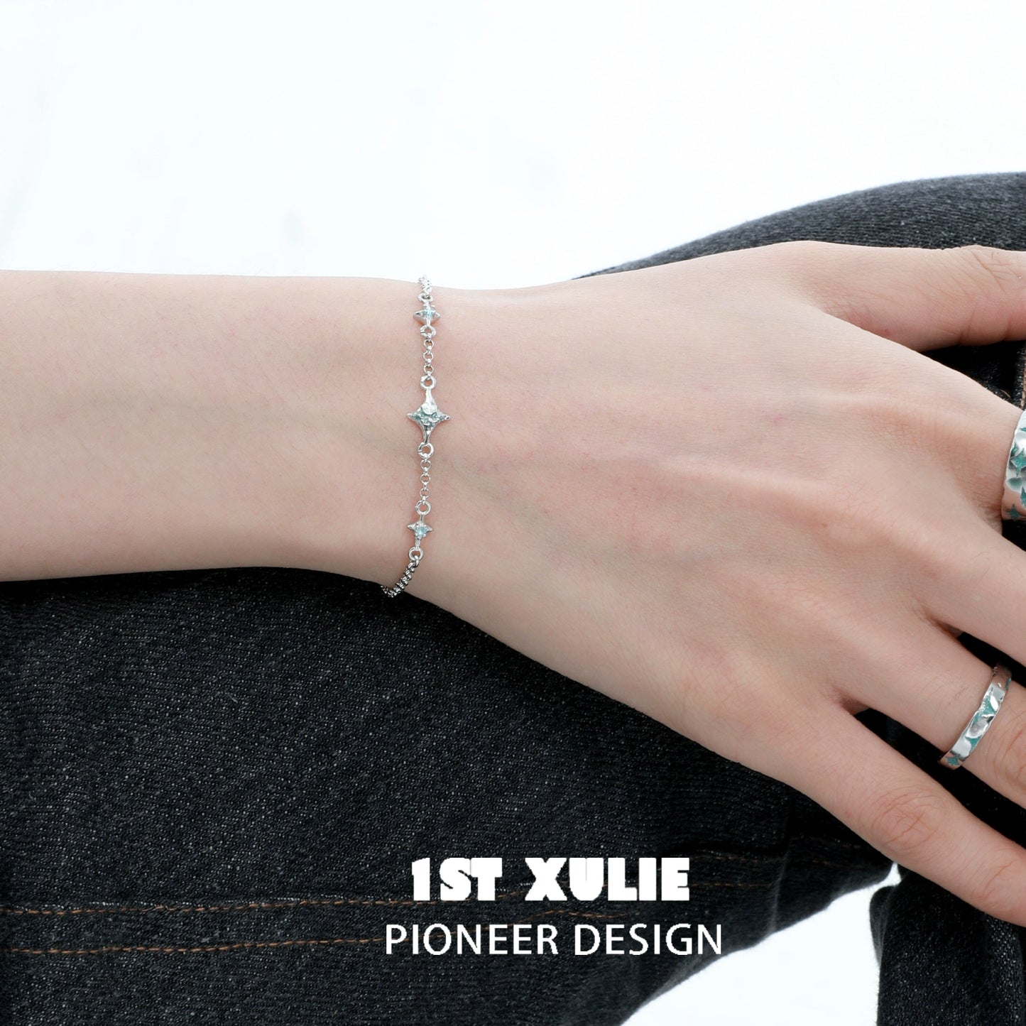 1STXULIE Silver Starlight Bracelet elegantly displayed on a wrist for a shimmering look