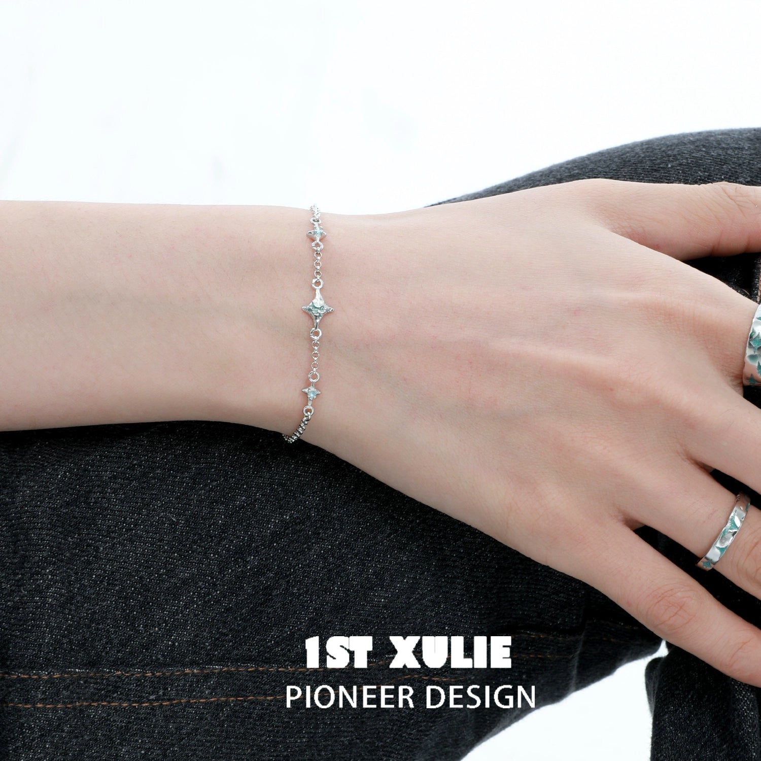 1STXULIE Silver Starlight Bracelet elegantly displayed on a wrist for a shimmering look