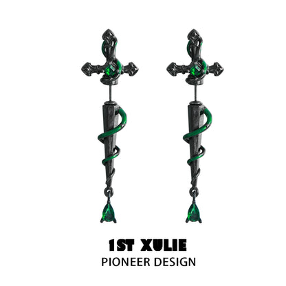 Slytherin inspired cross earrings featuring a snake design with emerald accents