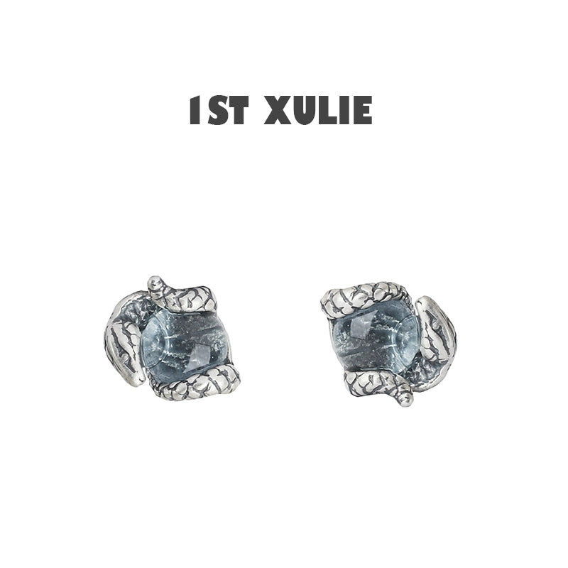 Slytherin snake earrings with detailed silver design and blue gemstone for a unique accessory