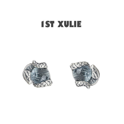 Slytherin snake earrings with detailed silver design and blue gemstone for a unique accessory