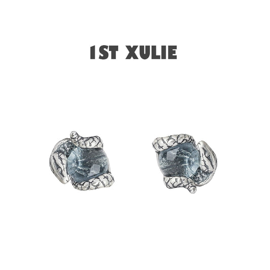 Slytherin snake earrings with detailed silver design and blue gemstone for a unique accessory