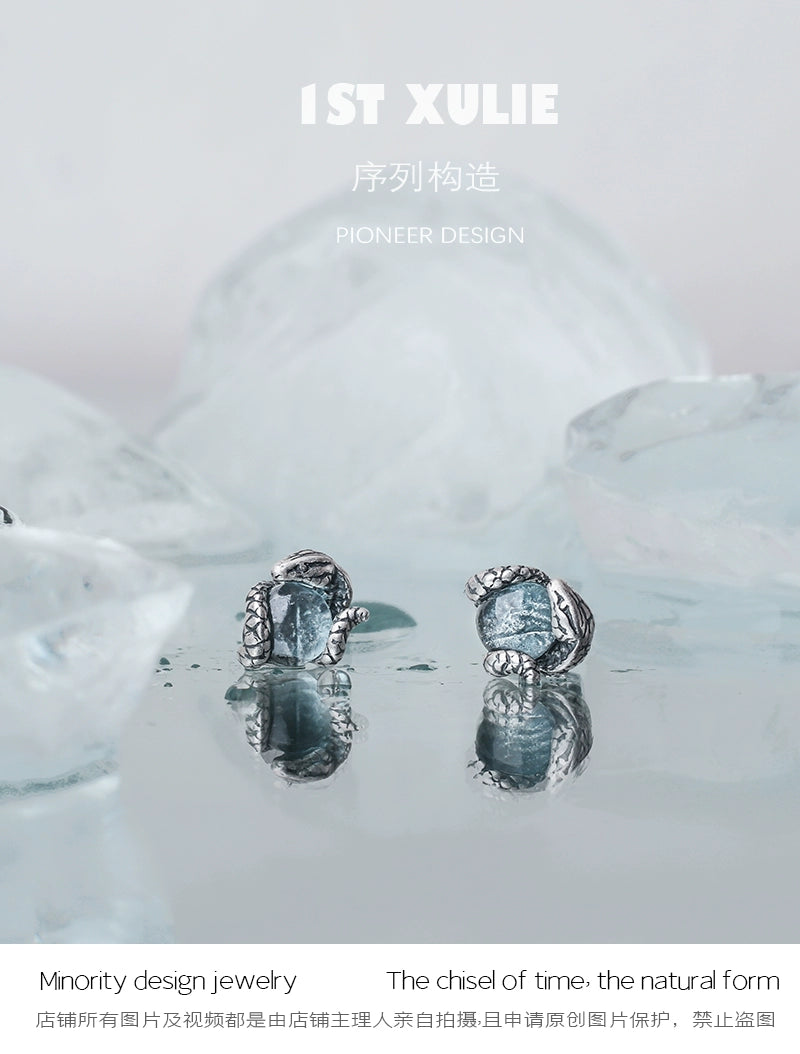Elegant Slytherin snake earrings with intricate detailing and a silver finish for fans of Harry Potter