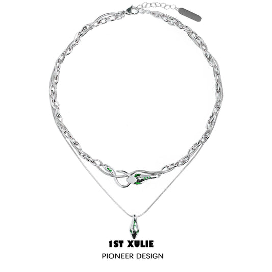 Slytherin snake necklace by 1STXULIE featuring a silver chain and green gemstone accents
