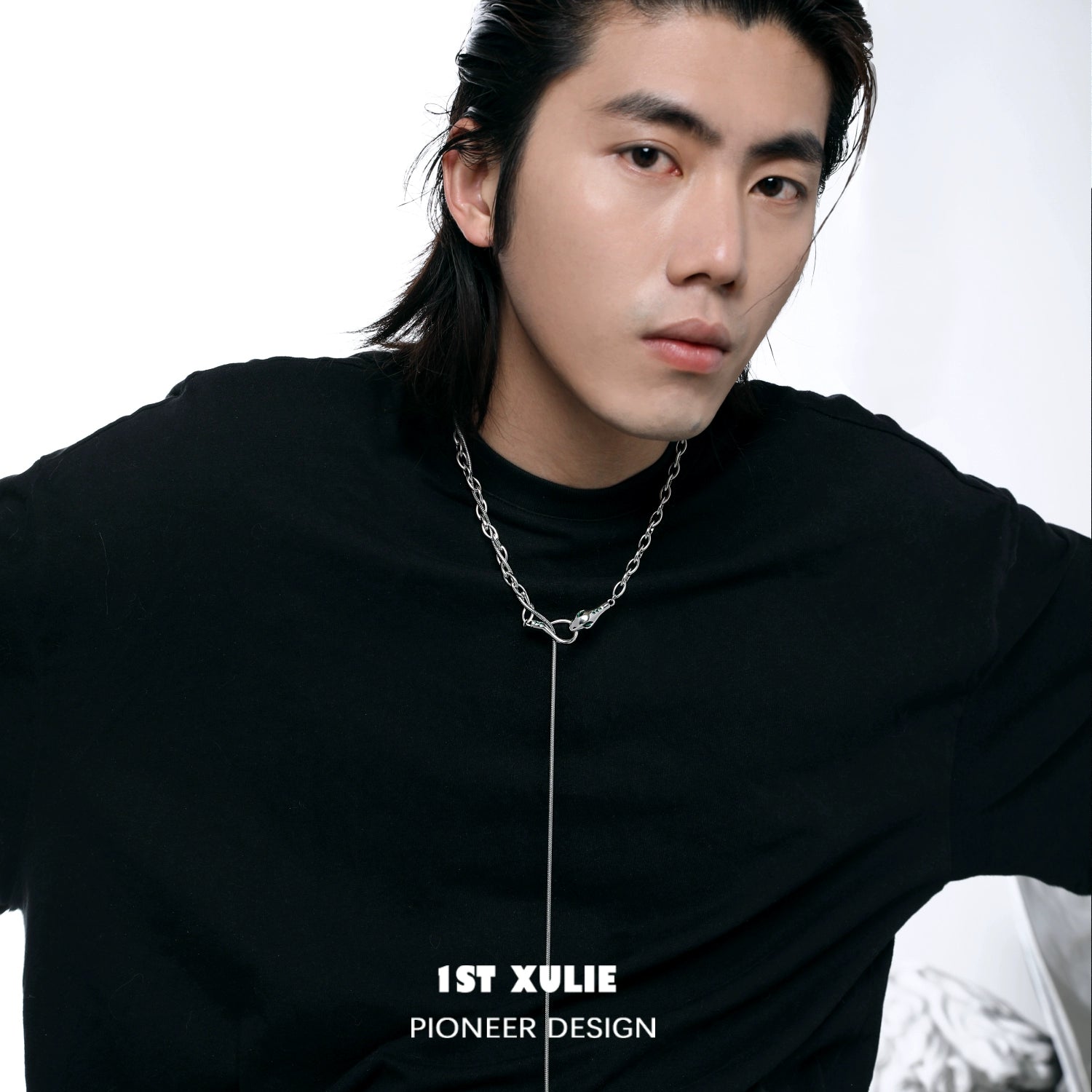 Stylish model wearing 1STXULIE Slytherin snake necklace with a bold chain design