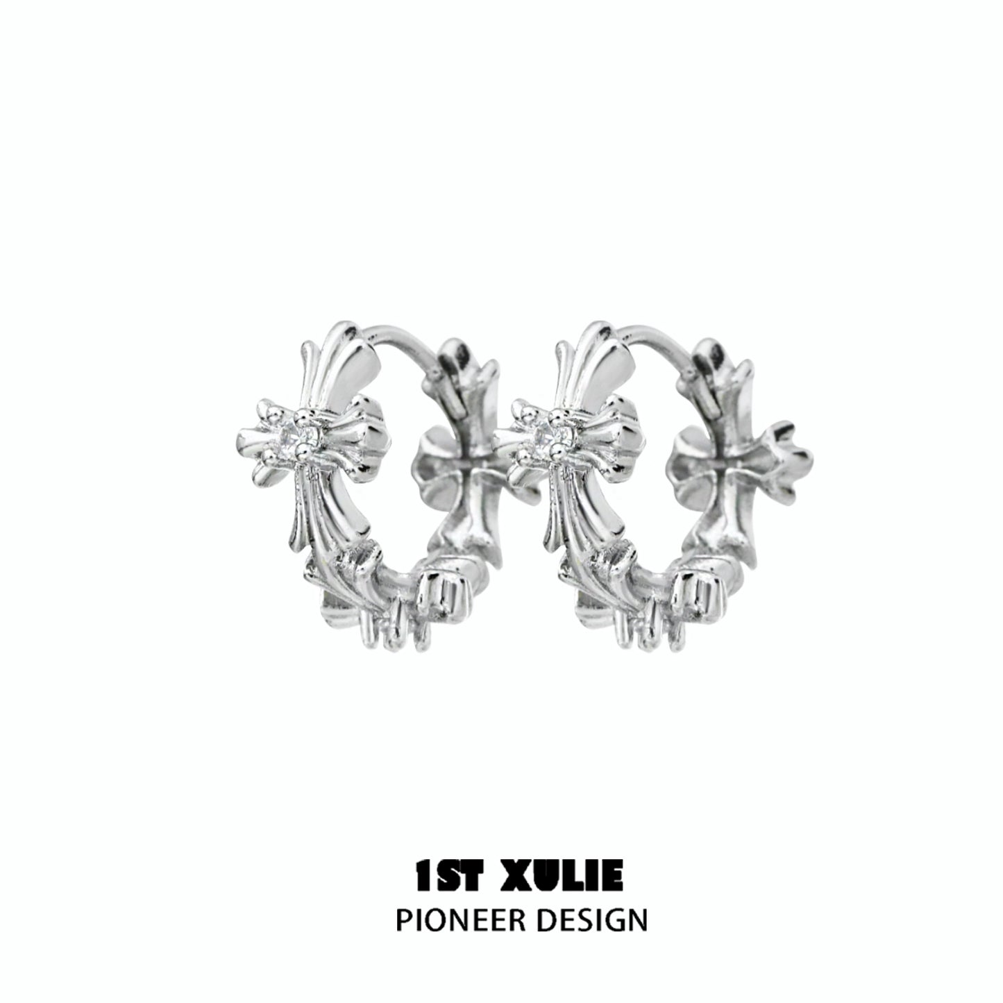Elegant spiked cross earrings in silver with intricate design, perfect for a bold fashion statement