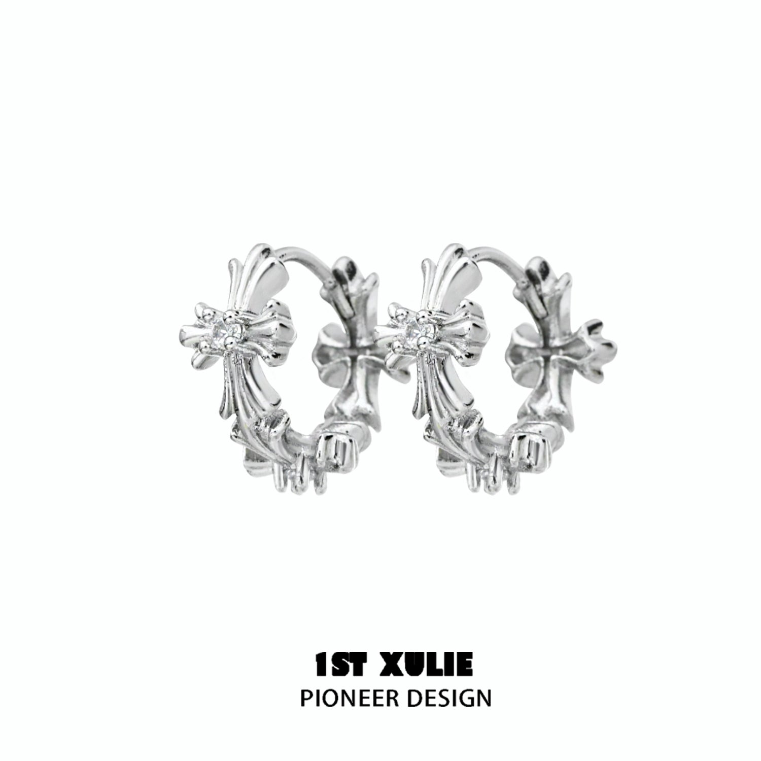 Elegant spiked cross earrings in silver with intricate design, perfect for a bold fashion statement