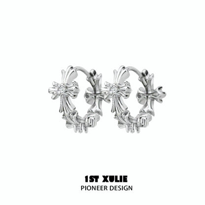Elegant spiked cross earrings in silver with intricate design, perfect for a bold fashion statement