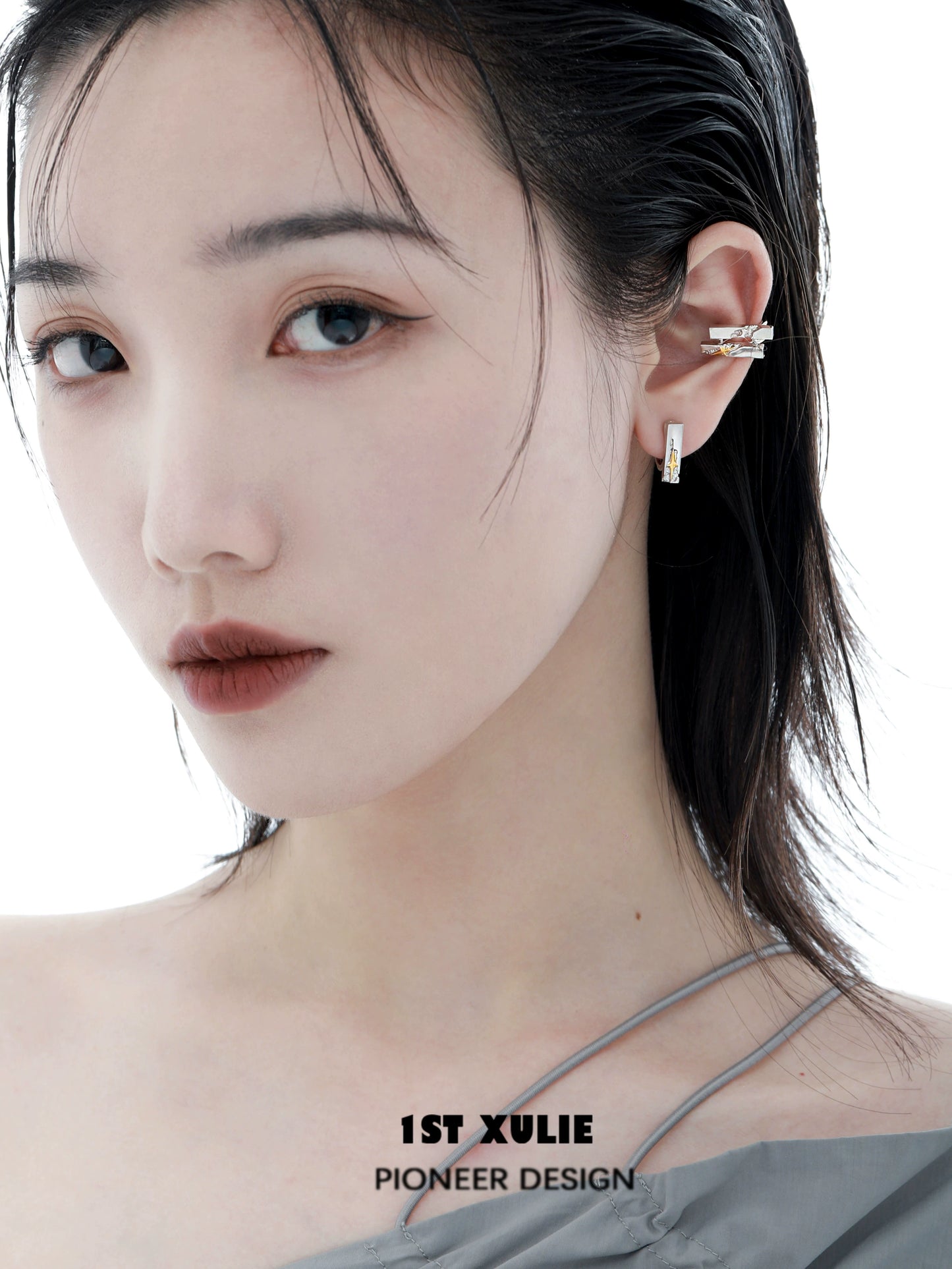 Elegant model wearing star ear cuff jewelry showcasing stylish design and modern appeal
