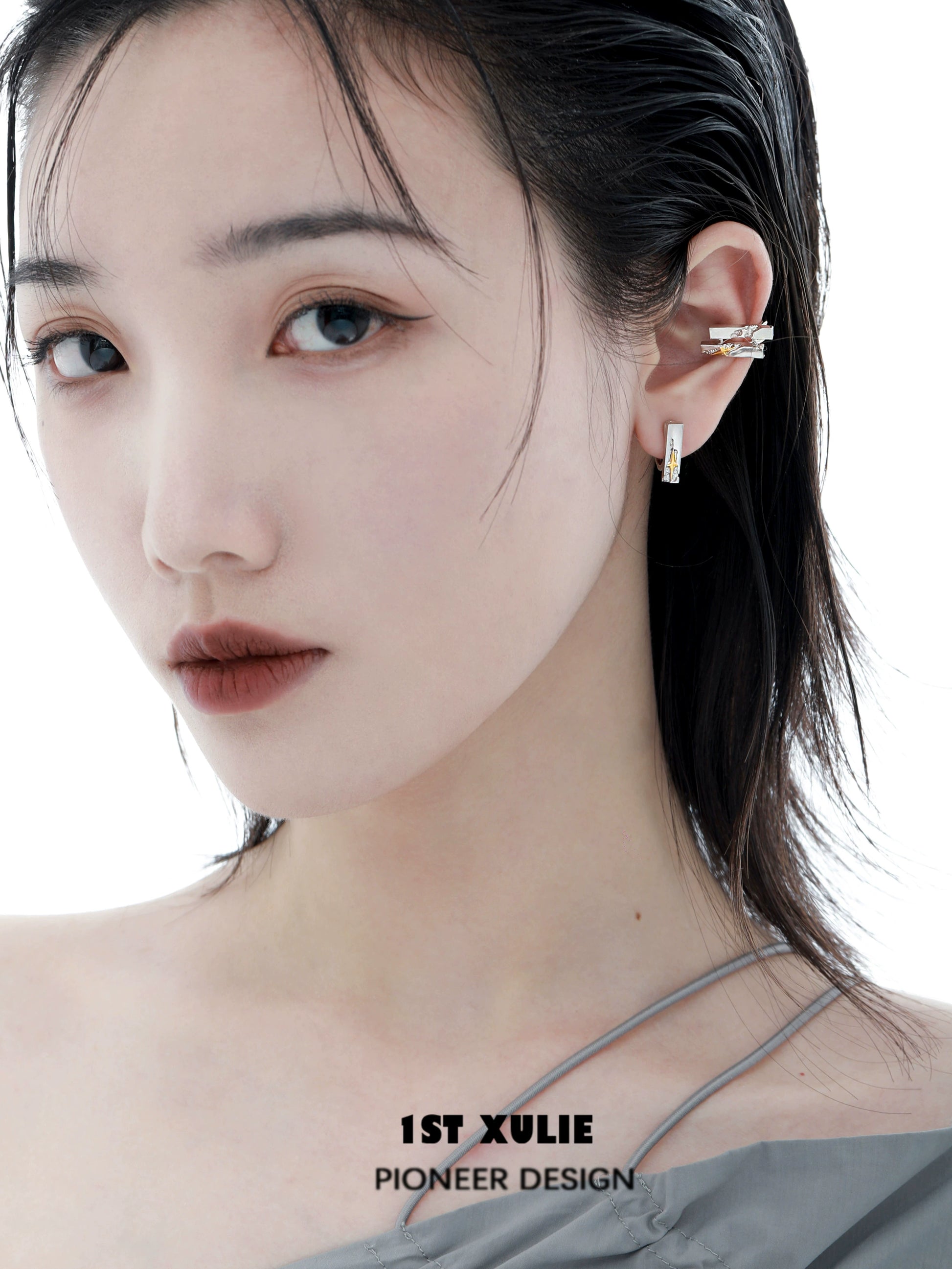 Elegant model wearing star ear cuff jewelry showcasing stylish design and modern appeal