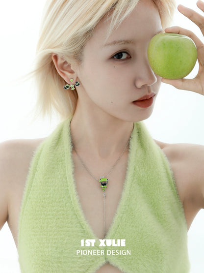Sweet apple pet removable earrings in a model's ears, paired with a green apple for a fresh look