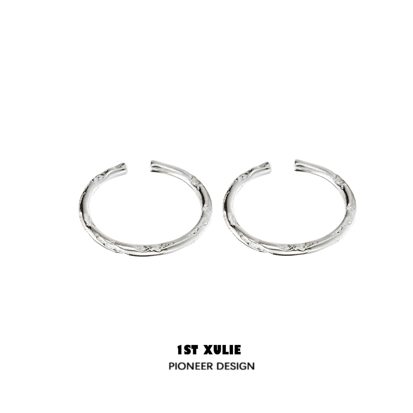 Textured silver ring from 1STXULIE showcases a unique design with intricate detailing