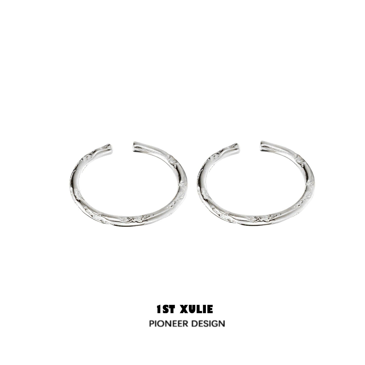 Textured silver ring from 1STXULIE showcases a unique design with intricate detailing