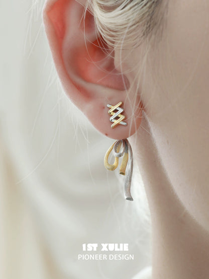 Elegant twisted bow earrings in gold and silver for stylish accessory lovers