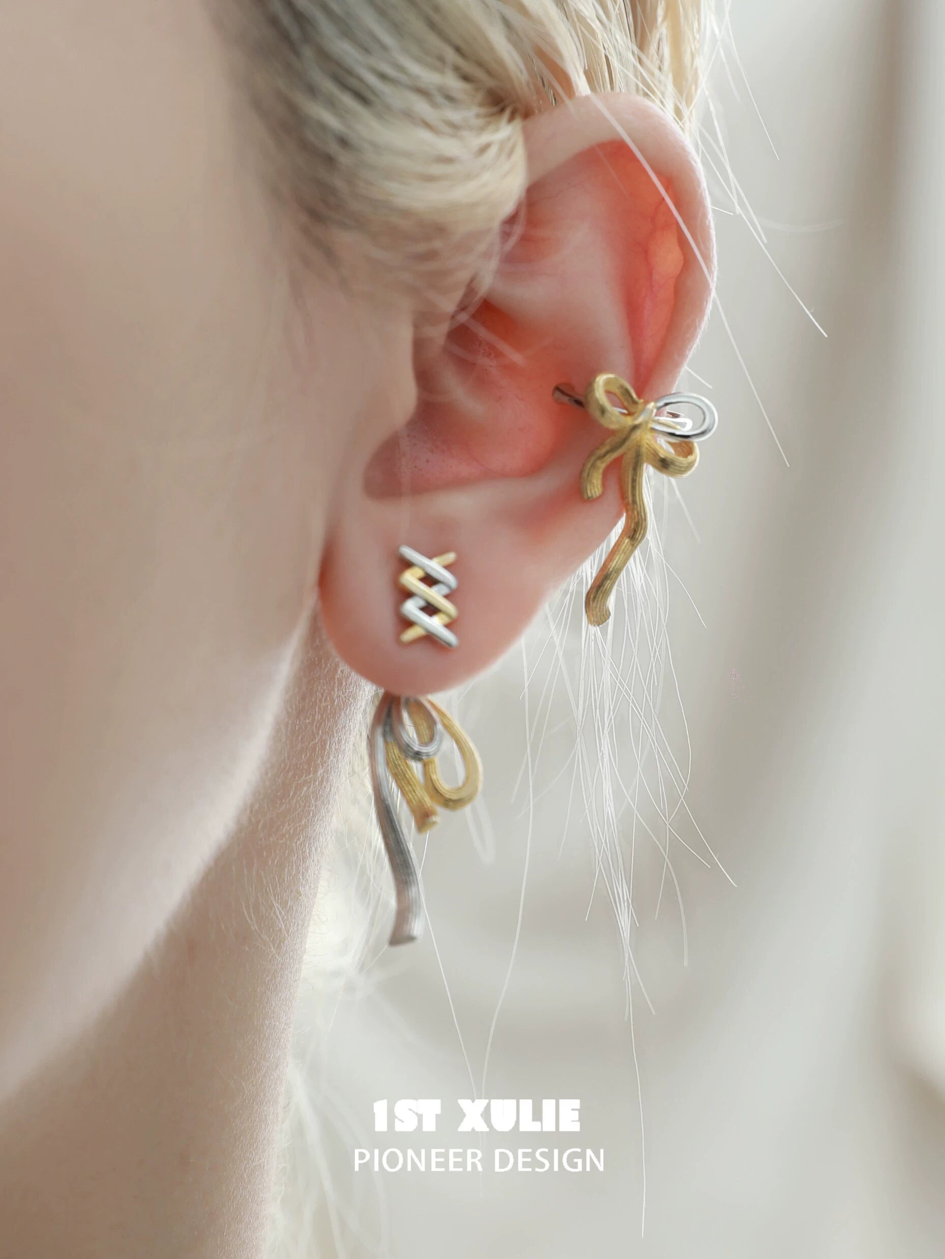 Twisted bow earrings by 1STXULIE with a unique two-tone design for elegant style