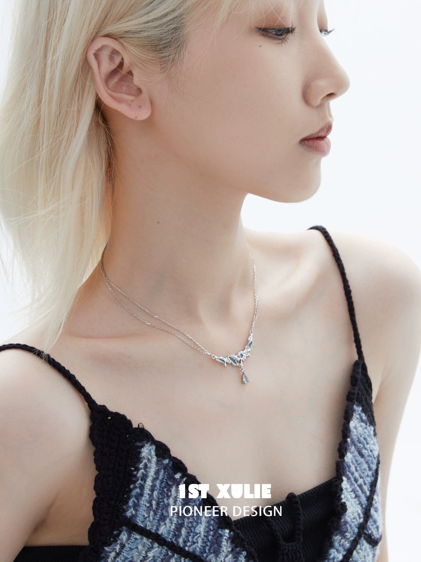 Model wearing a unique silver sea necklace showcasing elegant design and craftsmanship