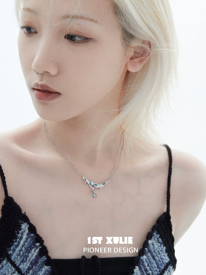 Model wearing a unique silver sea necklace with delicate design for ocean-inspired fashion